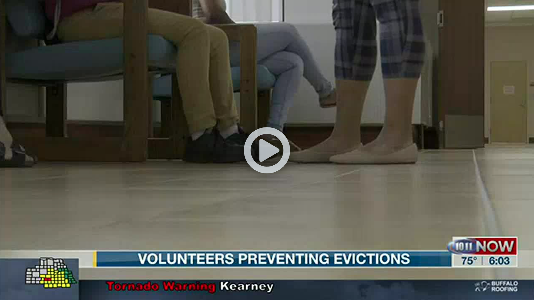 Screenshot of news story showing feet of clients and attorneys meeting at the courthouse