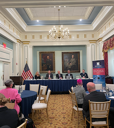 Panelists speak at the Army and Navy Club