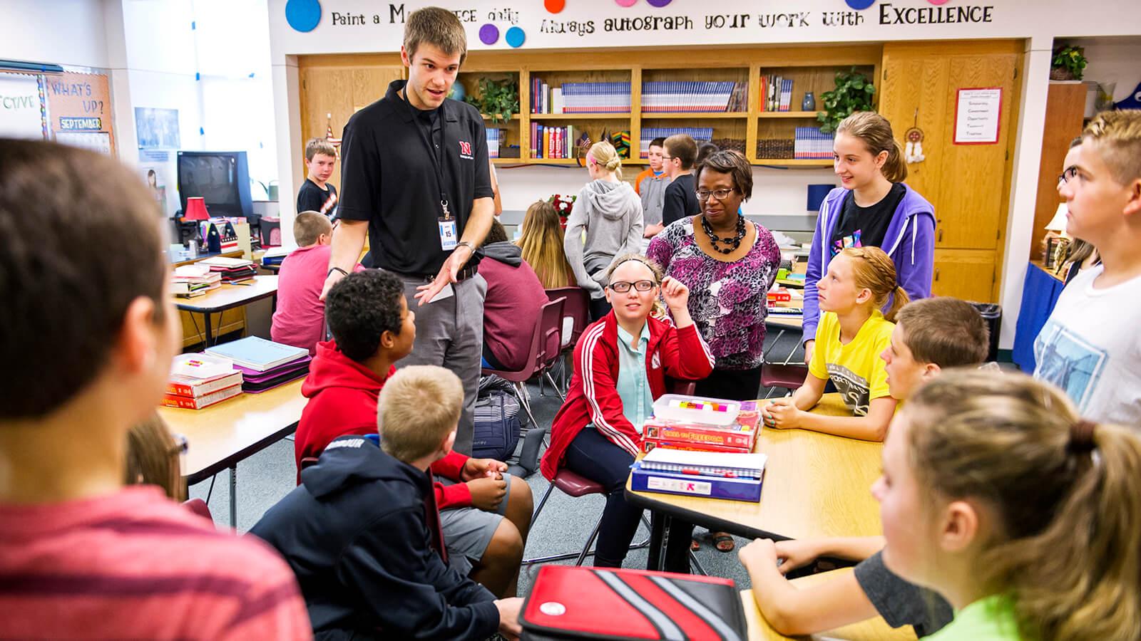 UNL student in a class with kids and teacher