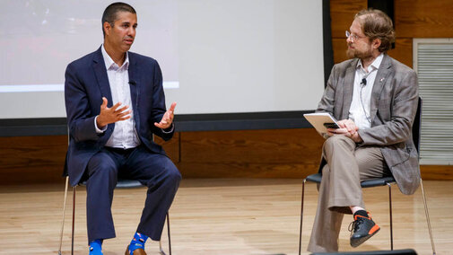 Two presenters sitting and talking 