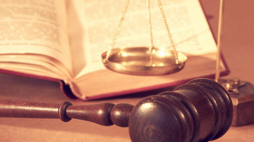 Mallet, scale, and open book