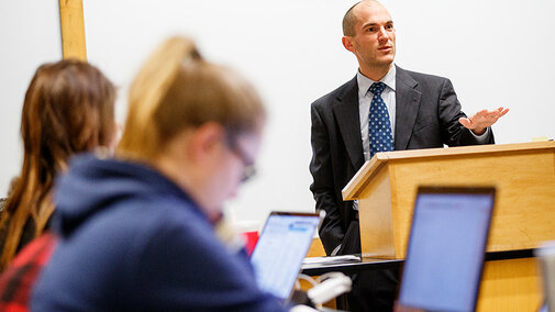 Lecturer speaking to students