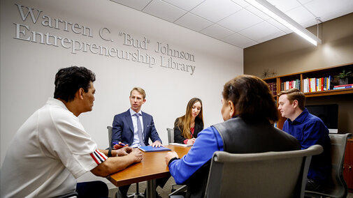 People sitting around a table in discussion