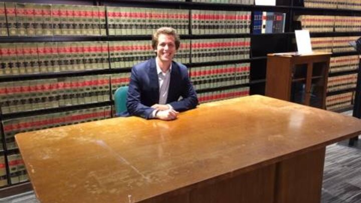 College of Law student Daniel Gutman of Omaha sits at the desk once used by Thurgood Marshall, the founder of the NAACP Legal Defense and Educational Fund and the first African-American U.S. Supreme Court Justice. Gutman is participating in a legal internship at LDF in New York made possible through a fellowship he received from the Nebraska Public Interest Law Fund.