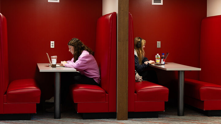 Brooklyn Steffen (left), a first-year student majoring in agribusiness, and Josephine Browning, a senior majoring in statistics, studying in cozy booths in the Nebraska East Union.