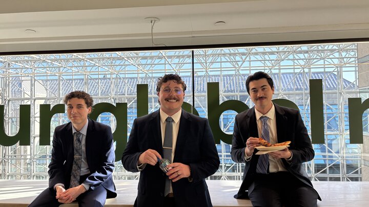 three Nebraska law students posing for a candid photo
