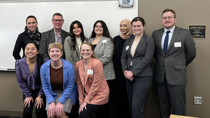 Students and attorney volunteers posing for a photo