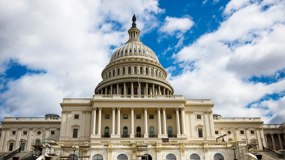 A congressional building against a blue sky