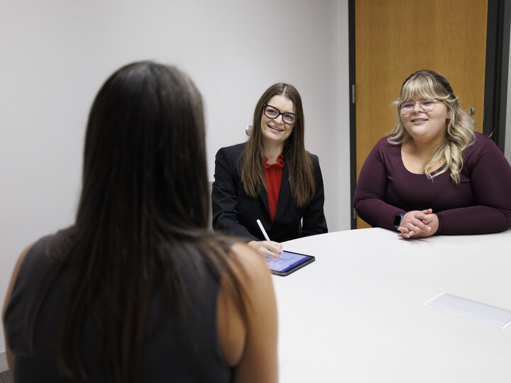 Three women sitting at a table
