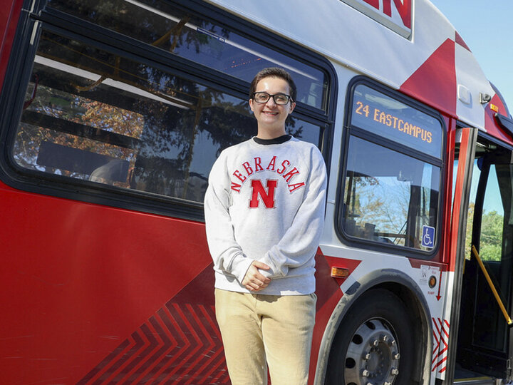 Andrew Dominguez Farias standing in front of a bus