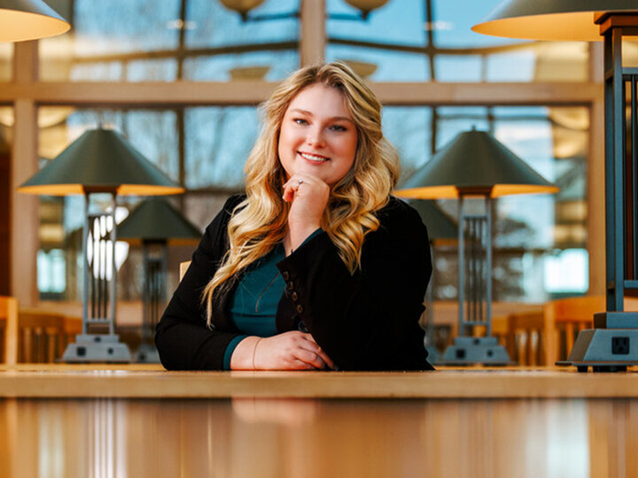 Delaney Doyle sitting at a library table