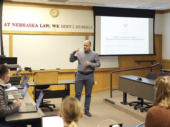 Professor Ondrej Filipec teaching in a small lecture room.