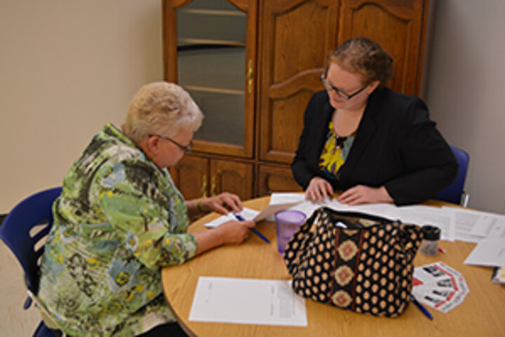 Two people looking at documents