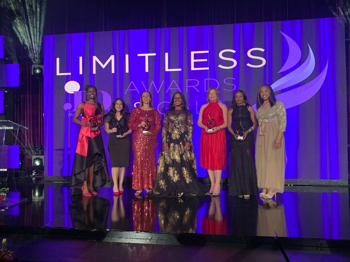 Brummond and fellow award winners stand on stage