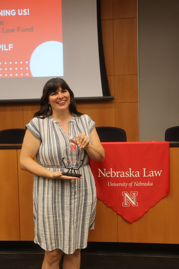 Diane Amdor, '13, accepts an award at the Justice Jam