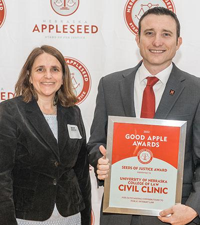 Nebraska Appleseed Executive Director Becky Gould and Professor Ryan Sullivan, director of the Civil Clinic, at the 2022 Good Apple Awards ceremony. Photo by Mike Machian.