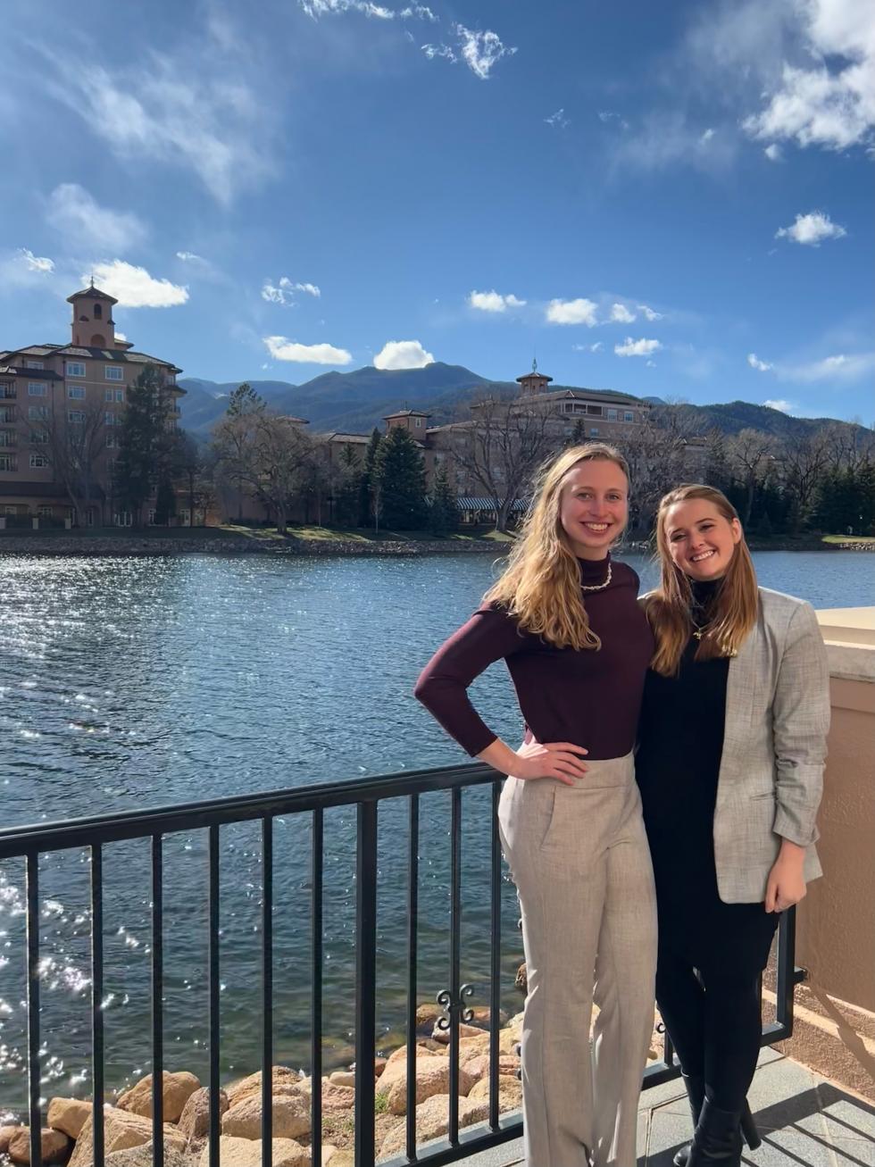 Independence Talken and Leana Brown stand in front of a pond at the Broadmoor Resort in Colorado Springs